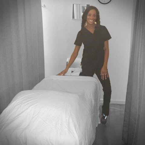 Eve, licensed massage therapist, in her private treatment room